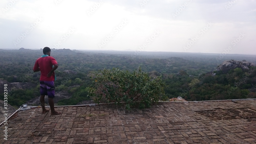 Man enjoys the view of the endless landscape