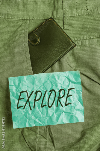 Text sign showing Explore. Business photo showcasing Travel somewhere unknown to learn about it Examine Evaluate Small little wallet inside man trousers front pocket near notation paper