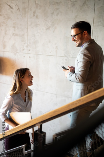 Business people having fun and chatting at workplace office