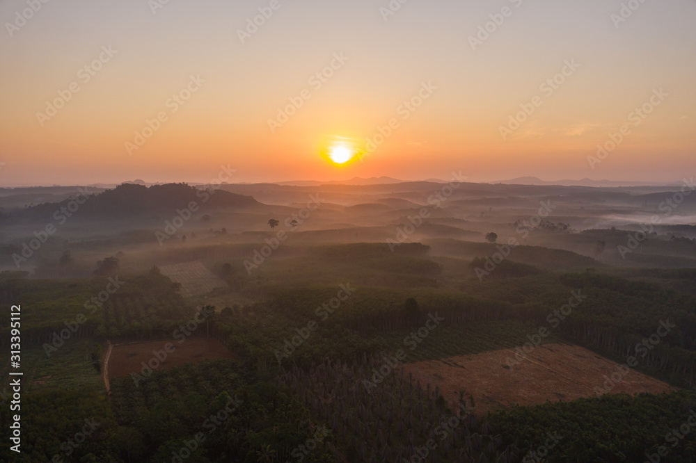 Beautiful sunrise with pagoda on the top of rock and tree with fog at Khao Na Nai Luang Dharma Park,Surat thani province,Thailand Beautiful sunrise with pagoda on the top of rock and tree with fog at Khao Na Nai Luang Dharma Park,Surat thani province,Thailand