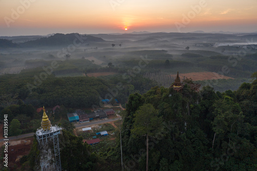 Wallpaper Mural Beautiful sunrise with pagoda on the top of rock and tree with fog at Khao Na Nai Luang Dharma Park,Surat thani province,Thailand Torontodigital.ca