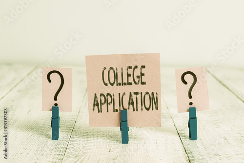 Text sign showing College Application. Business photo showcasing individuals apply to gain entry into a college Scribbled and crumbling sheet with paper clips placed on the wooden table