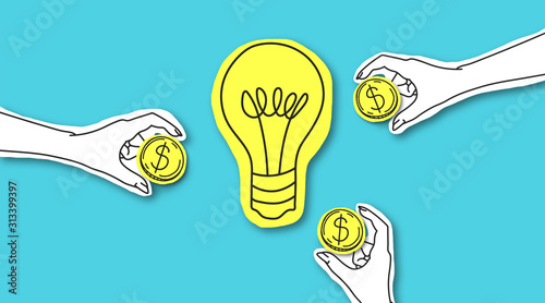 Hands with dollar sign coins around yellow light bulb photo