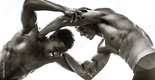 Photography Strong male black athletes wrestling. Strength competition.