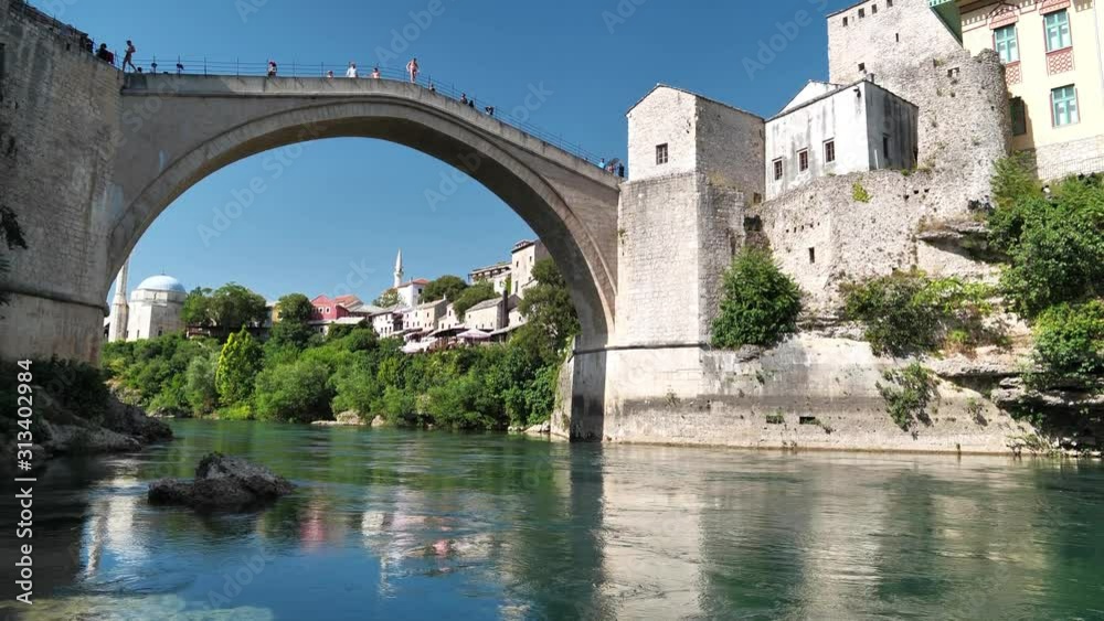 People on the bridge in old town of Mostar in Bosnia and Herzegovina People on the bridge in old town of Mostar in Bosnia and Herzegovina
