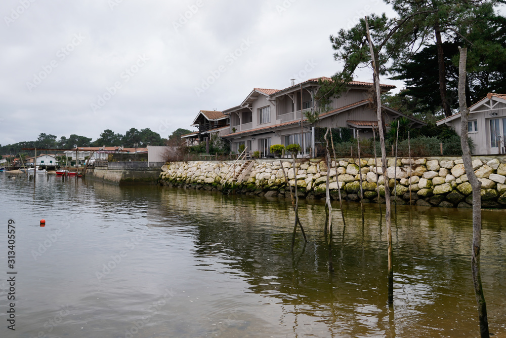 winter sunrise Arcachon Basin view of beach village L'Herbe in Cap Ferret winter sunrise Arcachon Basin view of beach village L'Herbe in Cap Ferret