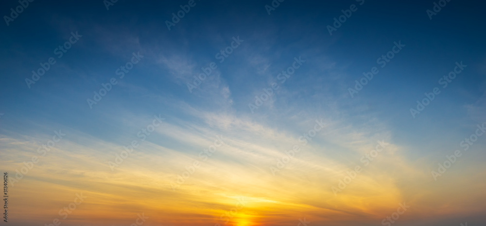 Blue sky and clouds with golden hour sun light panorama nature background