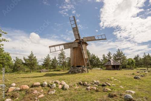 Grain mill on the summer landscape. Windmill and natural background pattern. Hiiumaa, small island in Estonia. Europe © Artenex