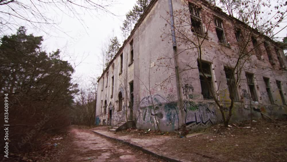 Ruins of a deserted building falling apart which was formerly a hospital for mental health today is a scared place, scene of horror movie. Ruins of a deserted building falling apart which was formerly a hospital for mental health today is a scared place, scene of horror movie.