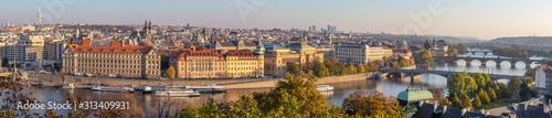 Prague - The panorama of the city with the bridges in evening light.