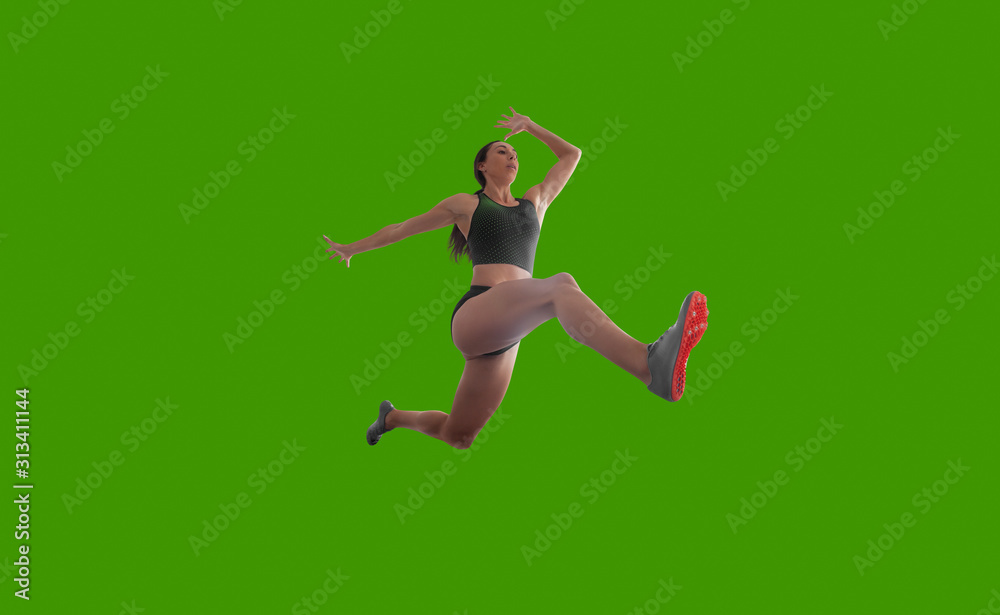 Female athlete isolated on green screen.