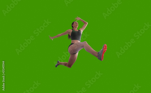 Female athlete isolated on green screen.