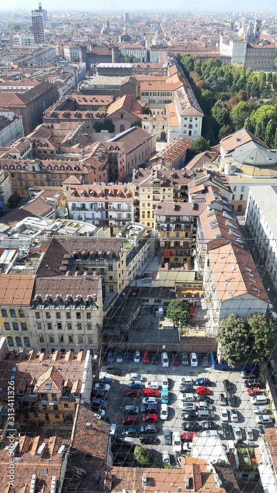 Fototapeta premium Turin, Italy - 01/004/2019: Beautiful panoramic view from Mole Antoneliana to the city of Turin in winter days with clear blue sky and the alps in the background. 