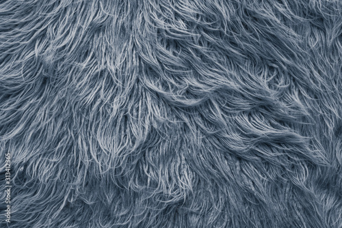 close-up natural grey wool rug background texture.