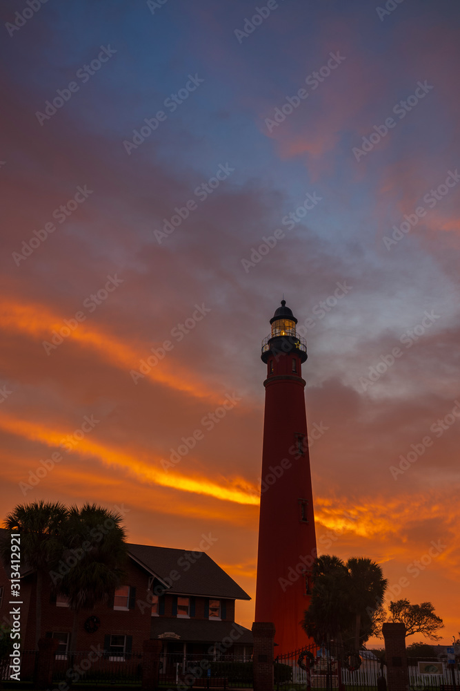 The Ponce de Leon Inlet Light, a lighthouse and museum located near Daytona Beach in central Florida, glows during a morning sunrise. At 175 feet in height, it is the tallest lighthouse in the state 