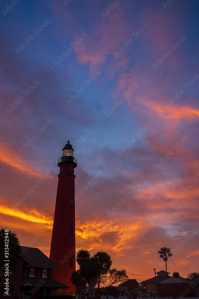 The Ponce de Leon Inlet Light, a lighthouse and museum located near Daytona Beach in central Florida, glows during a morning sunrise. At 175 feet in height, it is the tallest lighthouse in the state 