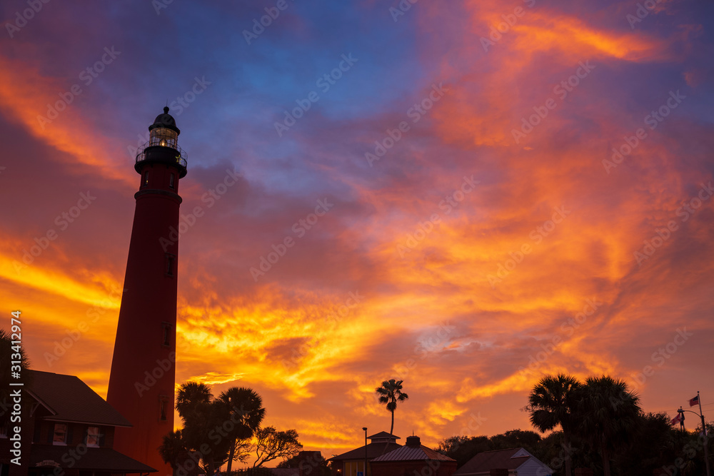 The Ponce de Leon Inlet Light, a lighthouse and museum located near Daytona Beach in central Florida, glows during a morning sunrise. At 175 feet in height, it is the tallest lighthouse in the state 
