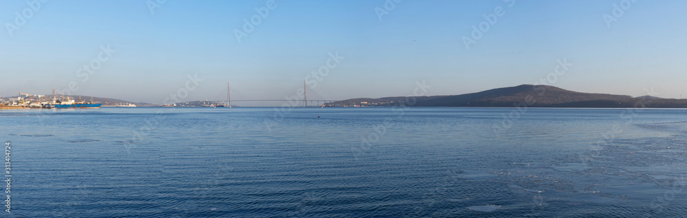 Panorama of the sea landscape with a view of the Russian bridge. Panorama of the sea landscape with a view of the Russian bridge.