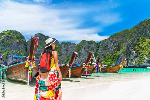 Summer lifestyle traveler woman joy relaxing on natural sea beach Maya bay Krabi, Famous landmark tourist travel Phuket Thailand summer holiday vacation trip, Tourism beautiful destinations place Asia