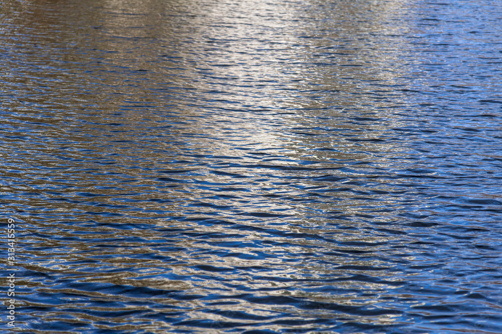 White and blue reflection on water surface. White and blue reflection on water surface.