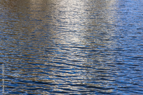 White and blue reflection on water surface.