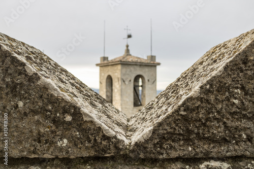 Ghibelline merlon with the tower view  in San Marino, the battlement with merlons in castle - Image photo