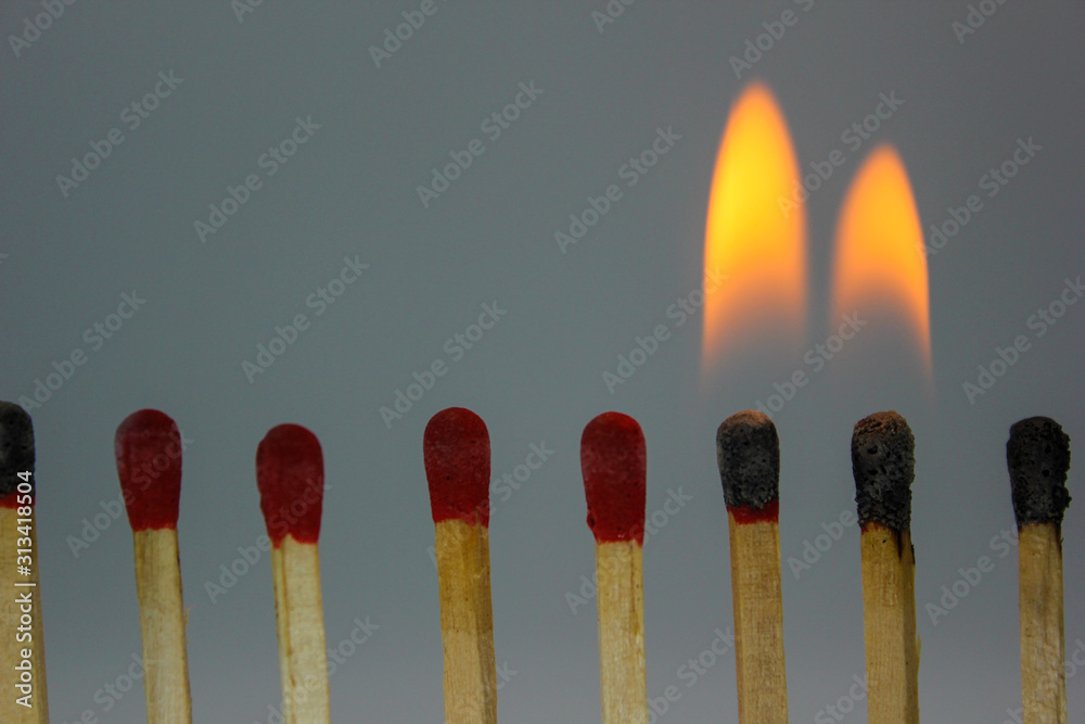 burning match on black background