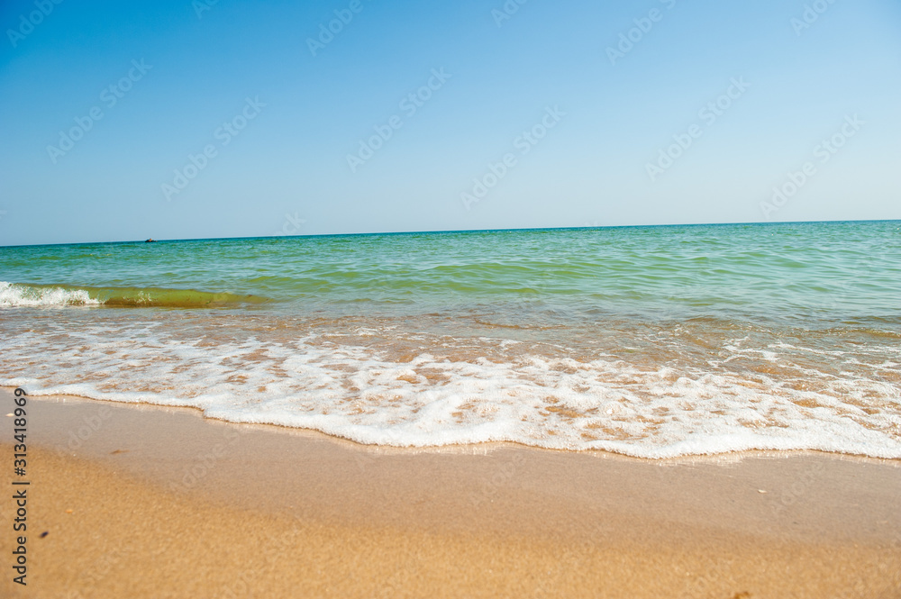 Background with a sea wave in the sand