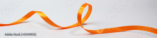 Orange ribbon isolated on white background