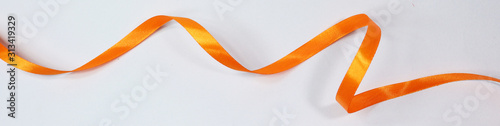 Orange ribbon isolated on white background