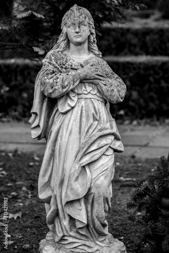 Statue of a mourning woman on a german graveyard, Friedhof Tegel, Berlin