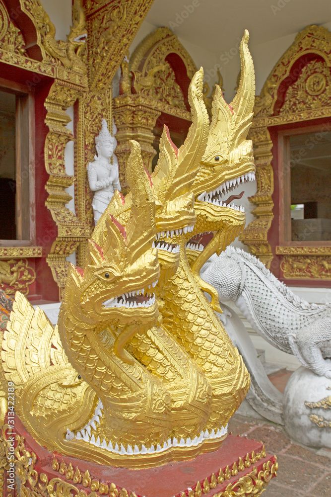Fototapeta premium Golden Naga at the stairs in Thai temples