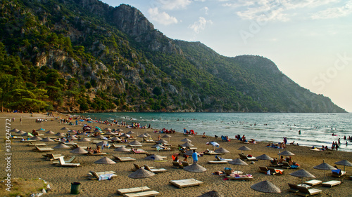 Fototapeta Naklejka Na Ścianę i Meble -  IZTUZU BEACH, MUGLA, TURKEY - AUGUST 25, 2019: Iztuzu beach and local and foreign tourists and those who want to see carettas show interest