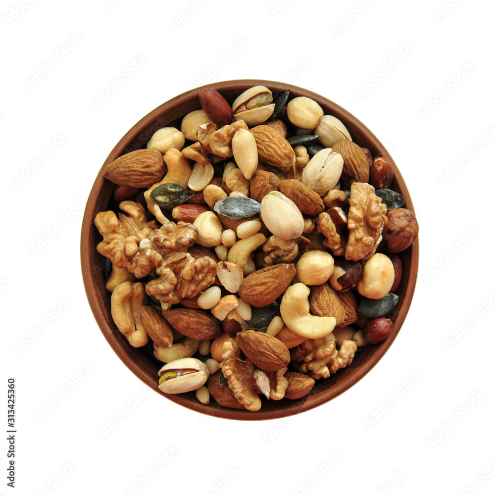 clay plate with nuts on a white background clay plate with nuts on a white background