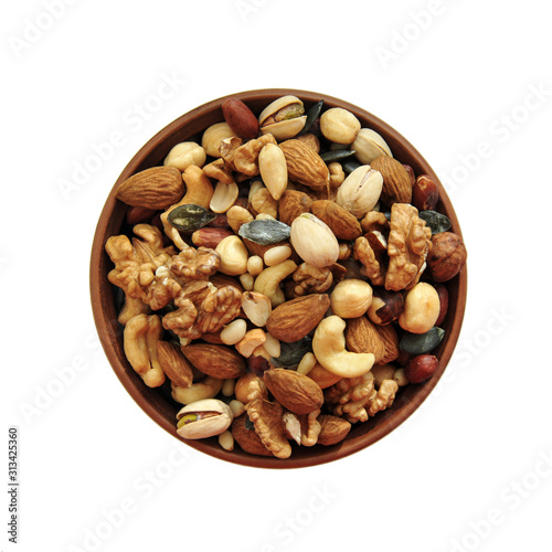 clay plate with nuts on a white background