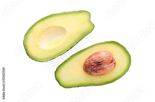 Top view of two fresh avocado slices with core isolated on a white background in close-up. 