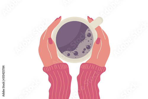 Female hands with coffee or tee mug.