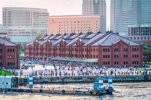 People are relaxing near the Famous red brick house in Yokohama port.