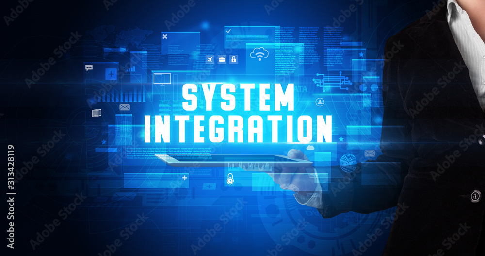 Young business person working on tablet and shows the digital sign: SYSTEM INTEGRATION Young business person working on tablet and shows the digital sign: SYSTEM INTEGRATION