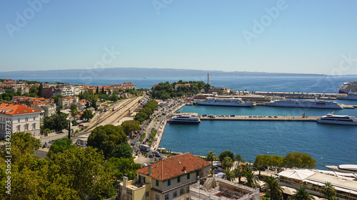 View of the southern part of Split from the bell tower of the Split Palace. Port, moorings, promenade, ships, railway station, tram tracks, island of Brac © ig130655
