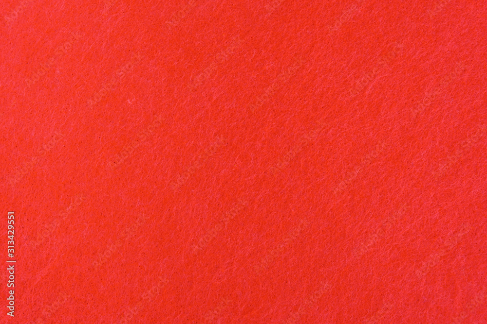 Fototapeta premium Abstract background with red felt texture, top view
