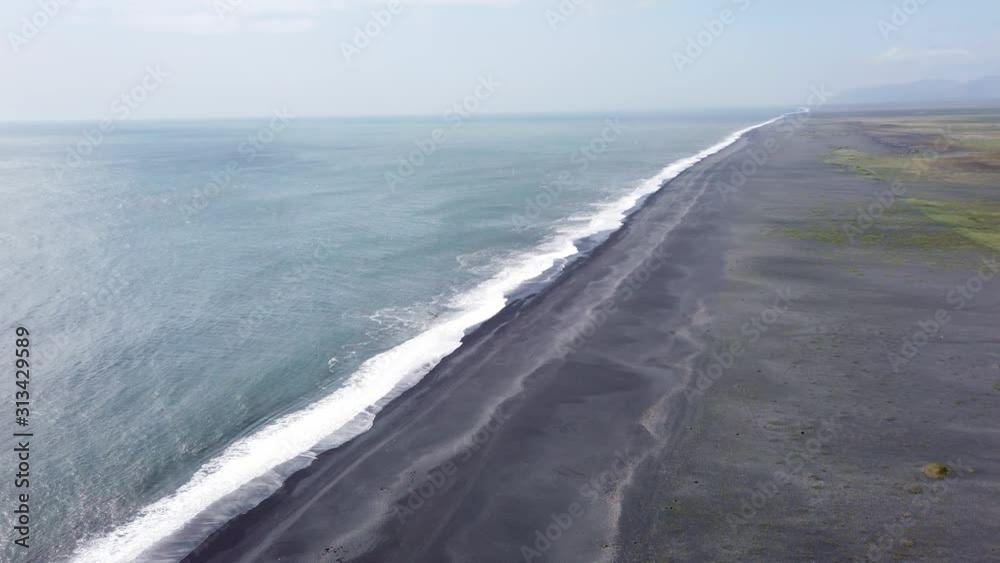 Endless volcanic black sand beach located in Vik, Iceland Endless volcanic black sand beach located in Vik, Iceland