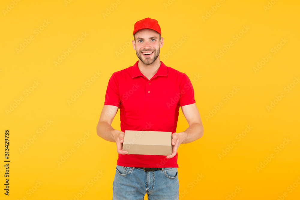 Delivering happiness and needs. Super fast courier agent. Service delivery. Salesman career. Courier and delivery. Postman delivery worker. Man red cap yellow background. Delivering purchase