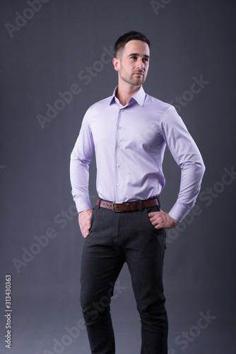 young man in a  blue shirt and dress pants