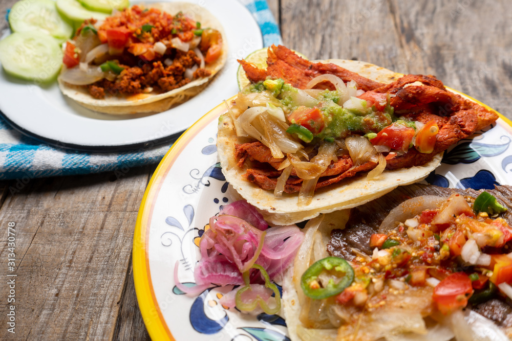 Mexican tacos on wooden background Mexican tacos on wooden background