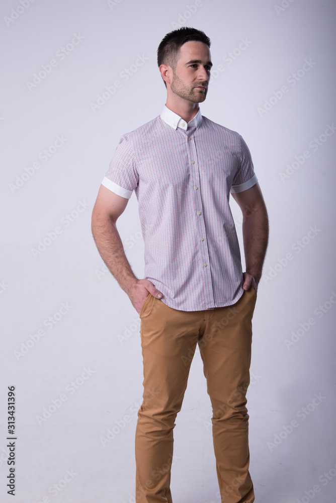 young man in blu shirt and jeans young man in blu shirt and jeans