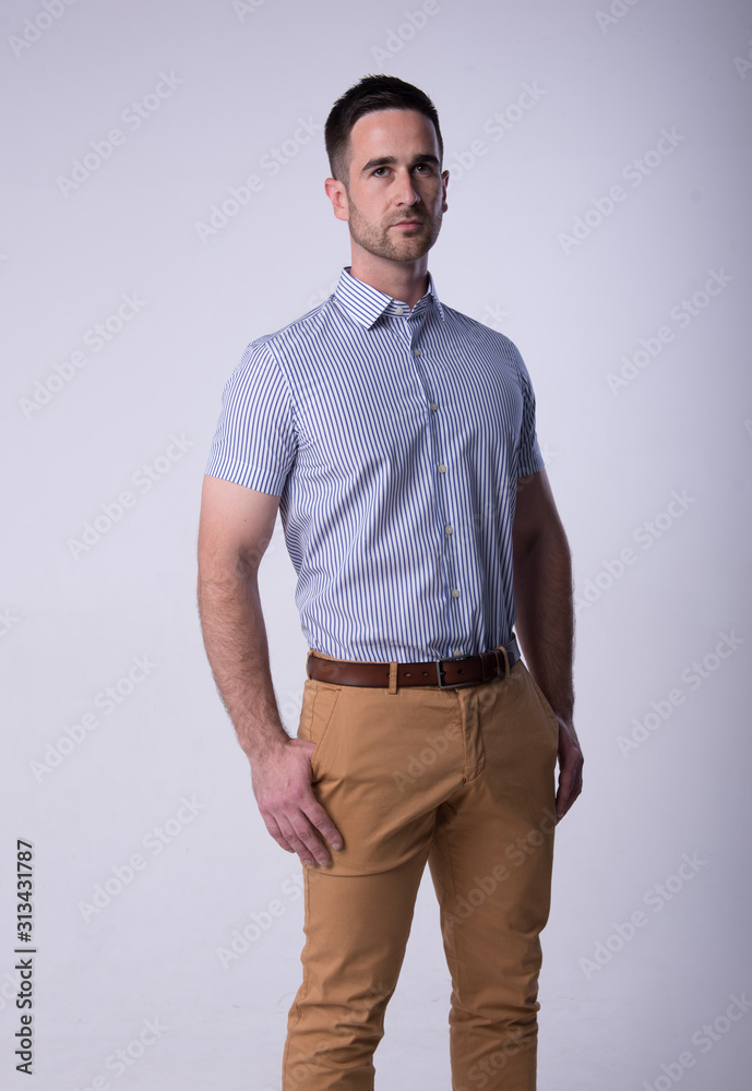 young man in blu shirt and jeans young man in blu shirt and jeans