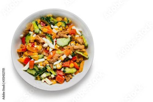 Bright vegetable salad in a white plate Isolated on a white background. Cooking a delicious dietary salad.