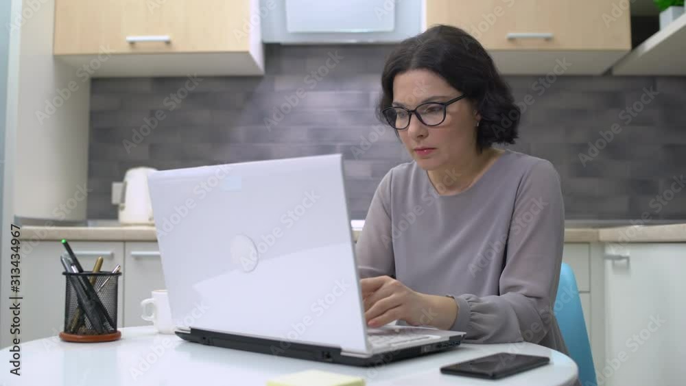 Tired employee feeling headache, working on laptop, health care, overwork Tired employee feeling headache, working on laptop, health care, overwork