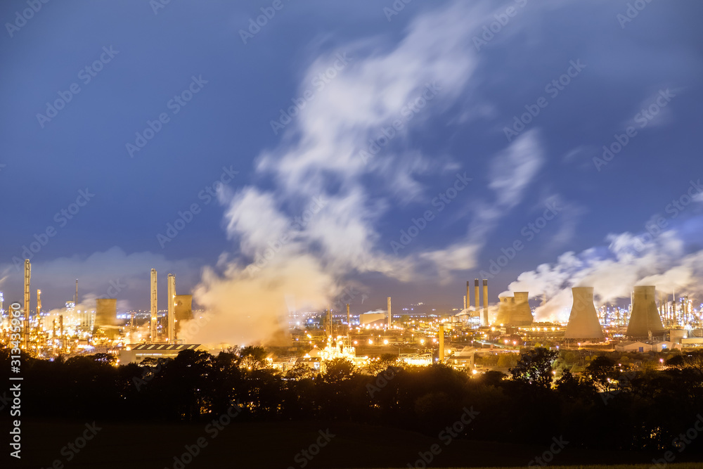 Naklejka premium Oil refinery, petrochemical industry night scene